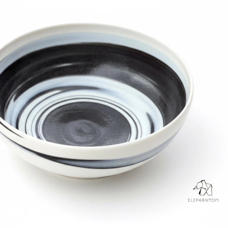 saladier noir et blanc en porcelaines mêlées